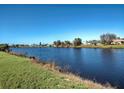 Scenic view of a tranquil canal with lush green landscape at 7379 Snow Dr, Englewood, FL 34224