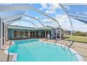 Inviting screened-in pool and patio area, perfect for relaxation at 156 Morgan Se Ln, Port Charlotte, FL 33952