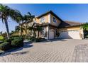 Two story home with large driveway and lush landscaping at 1209 San Mateo Dr, Punta Gorda, FL 33950