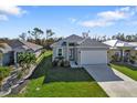 Aerial view of single-story home featuring well-manicured lawn and clean landscaping at 4255 Oak Terrace Cir, Port Charlotte, FL 33953