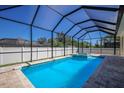 Refreshing screened pool and spa, perfect for outdoor enjoyment at 14294 Mcfarland Ave, Port Charlotte, FL 33981