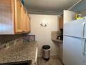 Kitchen corner with granite countertop and built-in appliances at 707 Riverview Cir, North Port, FL 34287