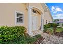 Inviting front entrance with columns and lush landscaping at 3743 Albacete Cir # 84, Punta Gorda, FL 33950