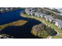 Condo building and surrounding landscape overview at 19345 Water Oak Dr # 208, Port Charlotte, FL 33948