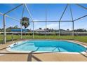 Refreshing, screened-in pool with steps for easy access at 3494 Yukon Dr, Port Charlotte, FL 33948
