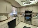 Kitchen with stainless steel appliances and tile floor at 2395 Harbor Blvd # 310, Port Charlotte, FL 33952