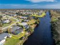 Aerial view showing home with pool, canal, and neighborhood at 2262 Hayworth Rd, Port Charlotte, FL 33952