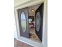 Double front doors with etched glass add curb appeal at 509 Clearview Dr, Port Charlotte, FL 33953