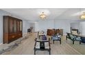 Condo living room with hardwood floors and Asian-inspired furniture at 25188 Marion Ave # E301, Punta Gorda, FL 33950