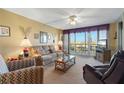 Relax in this living room with ample natural light at 25188 Marion Ave # B304, Punta Gorda, FL 33950