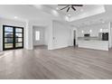 Open living room with kitchen and access to backyard at 17315 Cape Horn Blvd, Punta Gorda, FL 33955