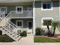 Two-story building with white railings and landscaping at 3310 Loveland Blvd # 604, Port Charlotte, FL 33980