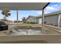 Relax in this covered hot tub overlooking the canal at 950 Genoa Ct, Punta Gorda, FL 33950