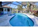 Inviting screened pool and spa with ample patio space for relaxation at 3173 S Cranberry Blvd, North Port, FL 34286