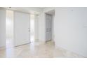 Elegant entryway with tiled floors and built-in storage at 1 Colony Point Dr # 16B, Punta Gorda, FL 33950