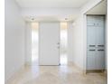 Bright entryway with tiled floor and large windows at 1 Colony Point Dr # 16B, Punta Gorda, FL 33950
