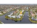 Waterfront property with lush landscaping and canal views at 950 Genoa Ct, Punta Gorda, FL 33950