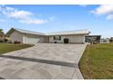 Single-story home with stone driveway and metal roof at 950 Genoa Ct, Punta Gorda, FL 33950