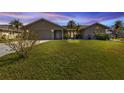 Well-maintained home exterior at dusk at 2328 Bonn Ct, Punta Gorda, FL 33983