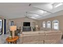 Bright living room with vaulted ceilings, neutral color palette, and comfortable seating at 2328 Bonn Ct, Punta Gorda, FL 33983