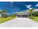 Single-Gathering home with a paver driveway at 9973 Calumet Blvd, Port Charlotte, FL 33981