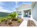 House exterior with landscaped walkway and porch at 9973 Calumet Blvd, Port Charlotte, FL 33981