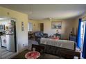 Open living and dining area with comfortable seating and a view into the kitchen at 860 Columbia St, Port Charlotte, FL 33948