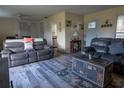 Living room with grey leather couches and wood-look flooring at 860 Columbia St, Port Charlotte, FL 33948