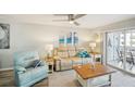 Relaxing living room with comfy seating and access to balcony at 150 Harborside Ave # 307, Punta Gorda, FL 33950