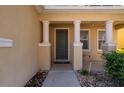 Front entry with columns and a walkway at 10044 Winding River Rd, Punta Gorda, FL 33950