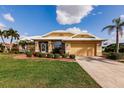 Attractive single-story home with a landscaped yard and metal roof at 2868 Coral Way, Punta Gorda, FL 33950