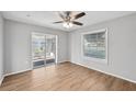 Bright bedroom with wood-look floors and sliding glass door to patio at 8109 San Jacinto Ave, North Port, FL 34287