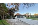 Single-story home with a two-car garage and spacious driveway at 20246 Hamilton Ave, Port Charlotte, FL 33952