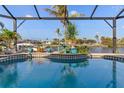 Inviting pool with screened enclosure and water view at 4271 Beach View Ct, Port Charlotte, FL 33948