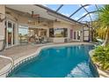 Relaxing pool area with spacious patio and access to interior at 4271 Beach View Ct, Port Charlotte, FL 33948