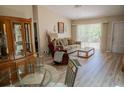 Living room with hardwood floors, a sofa, and a dining set at 3300 3300 # 3401, Punta Gorda, FL 33980