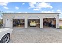 Three car garage with ample storage space and lift at 543 Lincoln Nw Ave, Port Charlotte, FL 33952