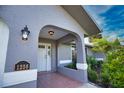 Inviting home exterior with a covered entryway and well-manicured landscaping at 1256 Alton Rd, Port Charlotte, FL 33952