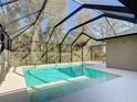 Inviting screened-in pool area, perfect for relaxation and entertainment, complete with sparkling water and ample space at 3316 Kacher Rd, North Port, FL 34288