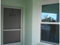 Front door and window of condo unit 4203 at 5725 Greenwood Ave # 4, North Port, FL 34287