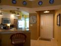 Galley kitchen with granite countertops and stainless steel appliances at 5725 Greenwood Ave # 4, North Port, FL 34287