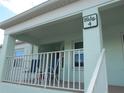 Building exterior featuring a balcony with seating at 5725 Greenwood Ave # 4, North Port, FL 34287