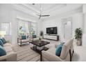 Spacious living room with contemporary furniture and large TV at 7116 Quigley St, Englewood, FL 34224