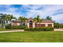 Single-Gathering house with three-car garage, palm trees at 300 Madrid Blvd, Punta Gorda, FL 33950