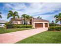Single-Gathering home with three-car garage and lush landscaping at 300 Madrid Blvd, Punta Gorda, FL 33950
