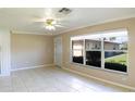 Bright living room with tile flooring and large windows at 21150 Gertrude Ave # A3, Port Charlotte, FL 33952