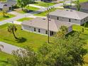 An aerial view of a backyard with a covered patio and lush green lawn at 1293 Preston St, Port Charlotte, FL 33952