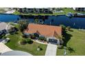 Single-story home with tile roof and canal-front access at 1542 Kinglet Dr, Punta Gorda, FL 33950