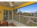 Relaxing screened porch with seating overlooking the lush greenery and community pool, perfect for unwinding at 2000 Bal Harbor Blvd # 321, Punta Gorda, FL 33950