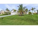 Single-story home with attached garage and lush lawn at 24004 Vincent Ave, Punta Gorda, FL 33955